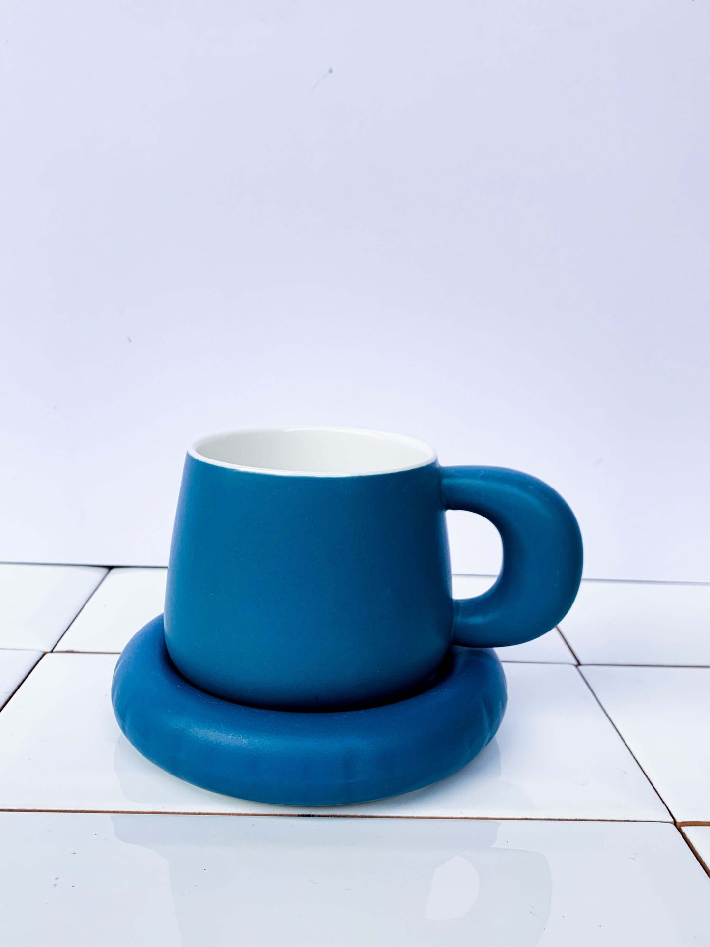 Dusk blue ceramic coffee cup and saucer