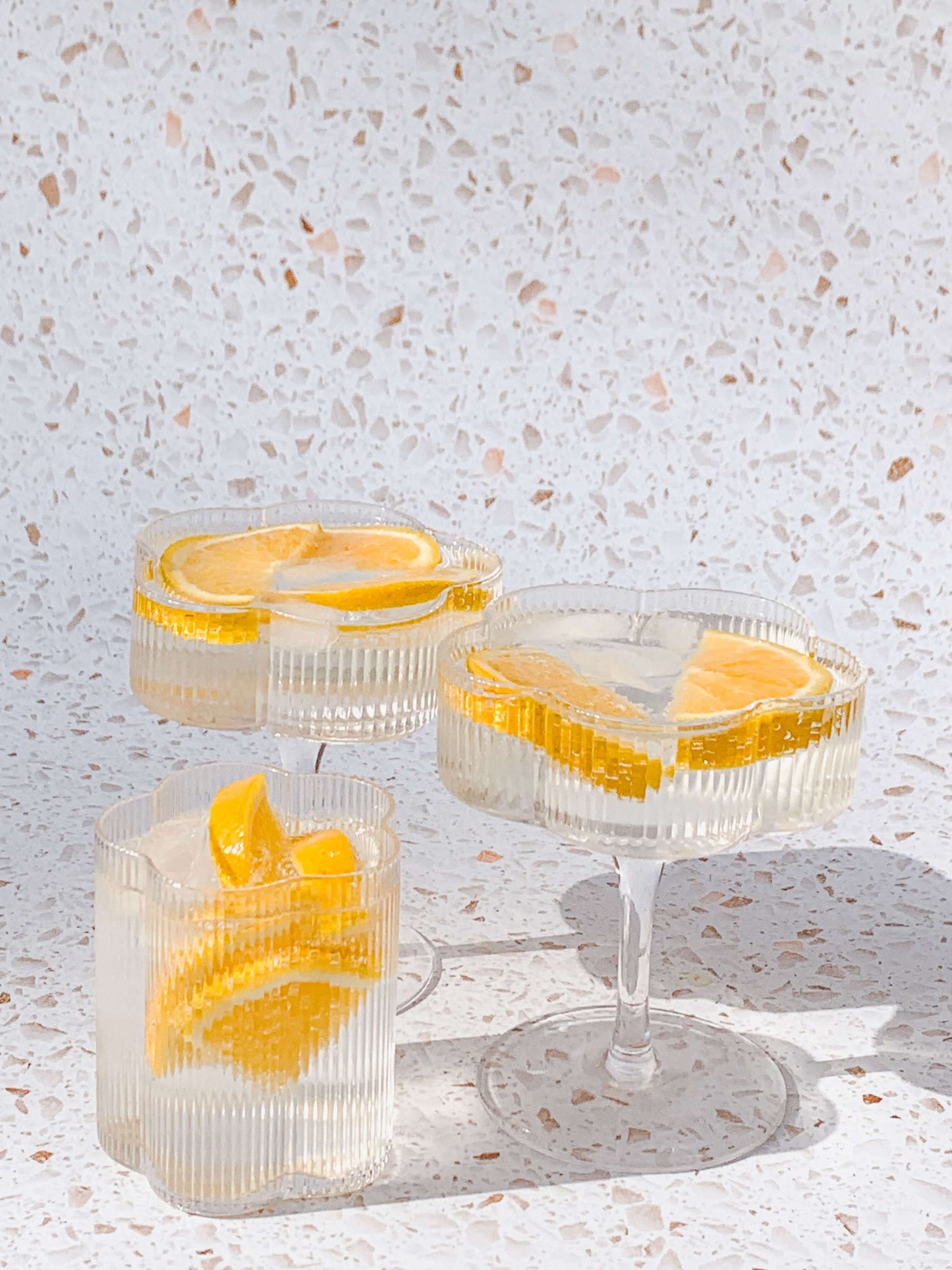Set of three, pretty ribbed floral cocktail glasses.