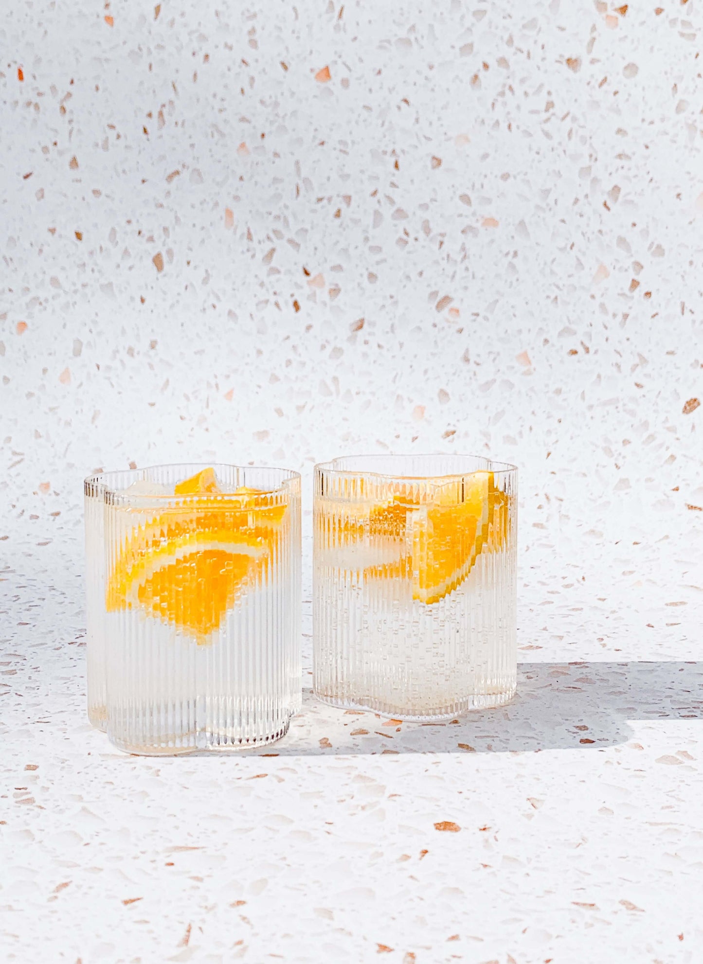 Set of two ribbed floral short glass tumblers