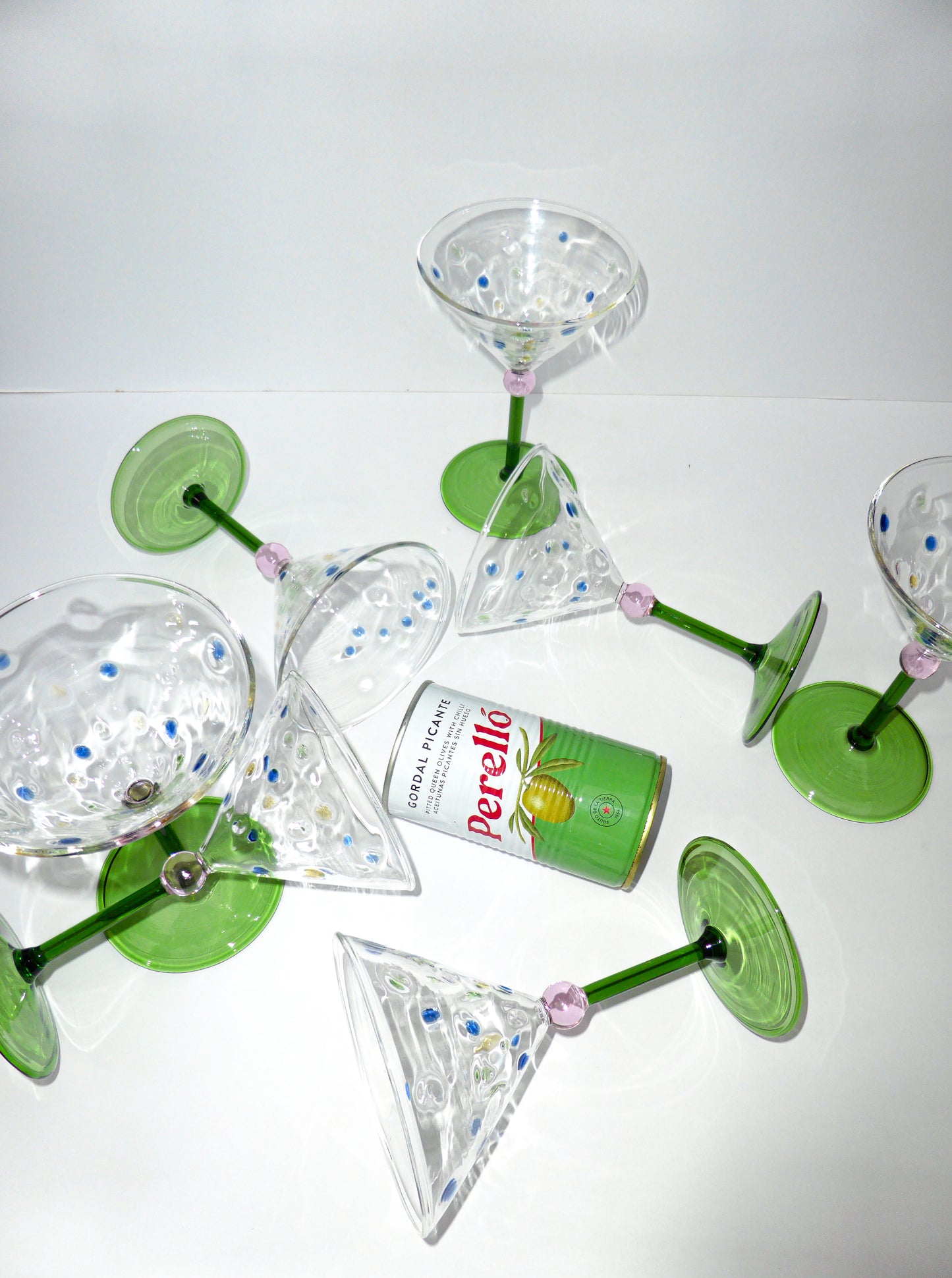 Image of of multiple unique colourful martini glasses stud up and lay down 