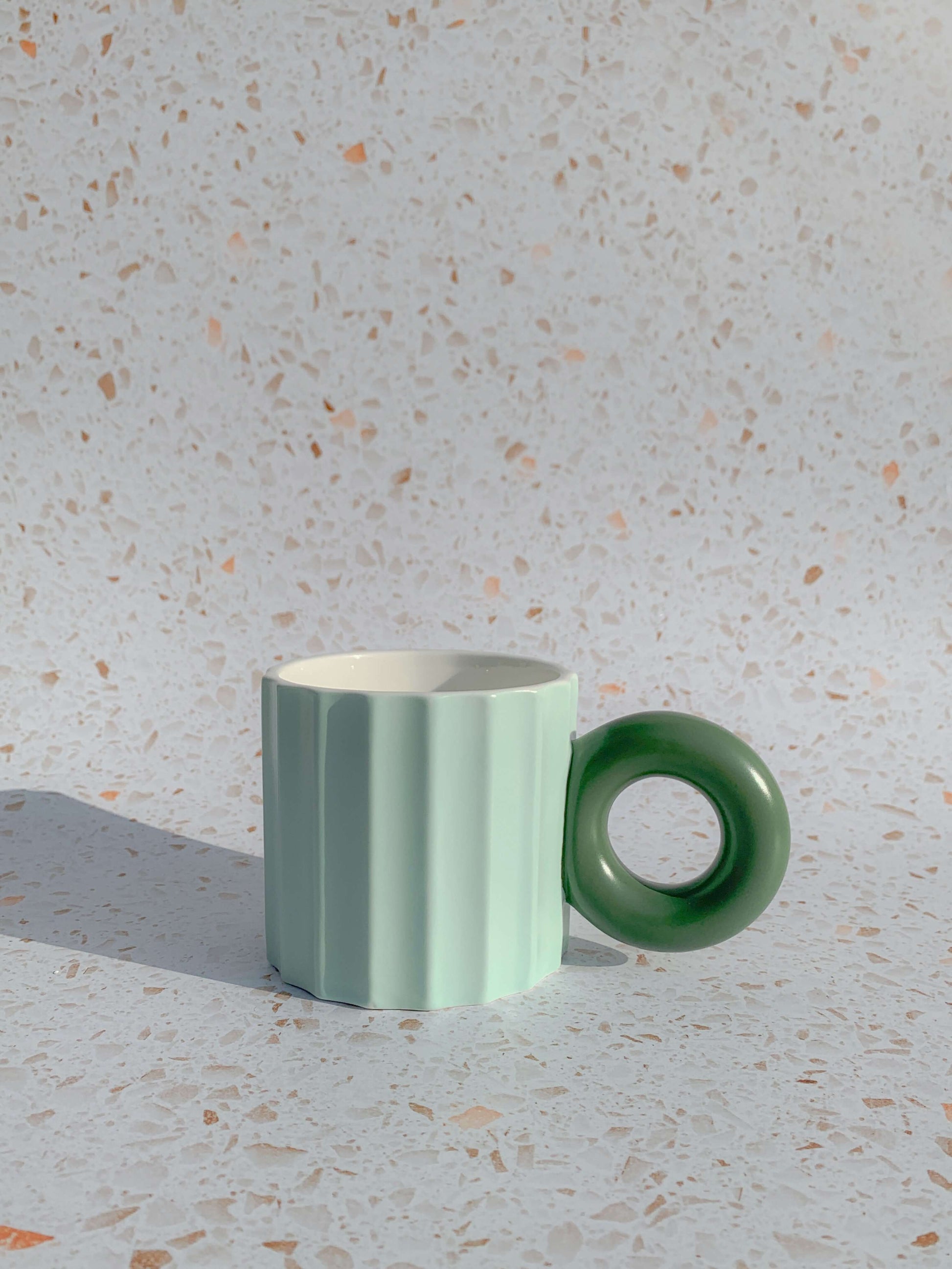 Pastel green ribbed ceramic mug