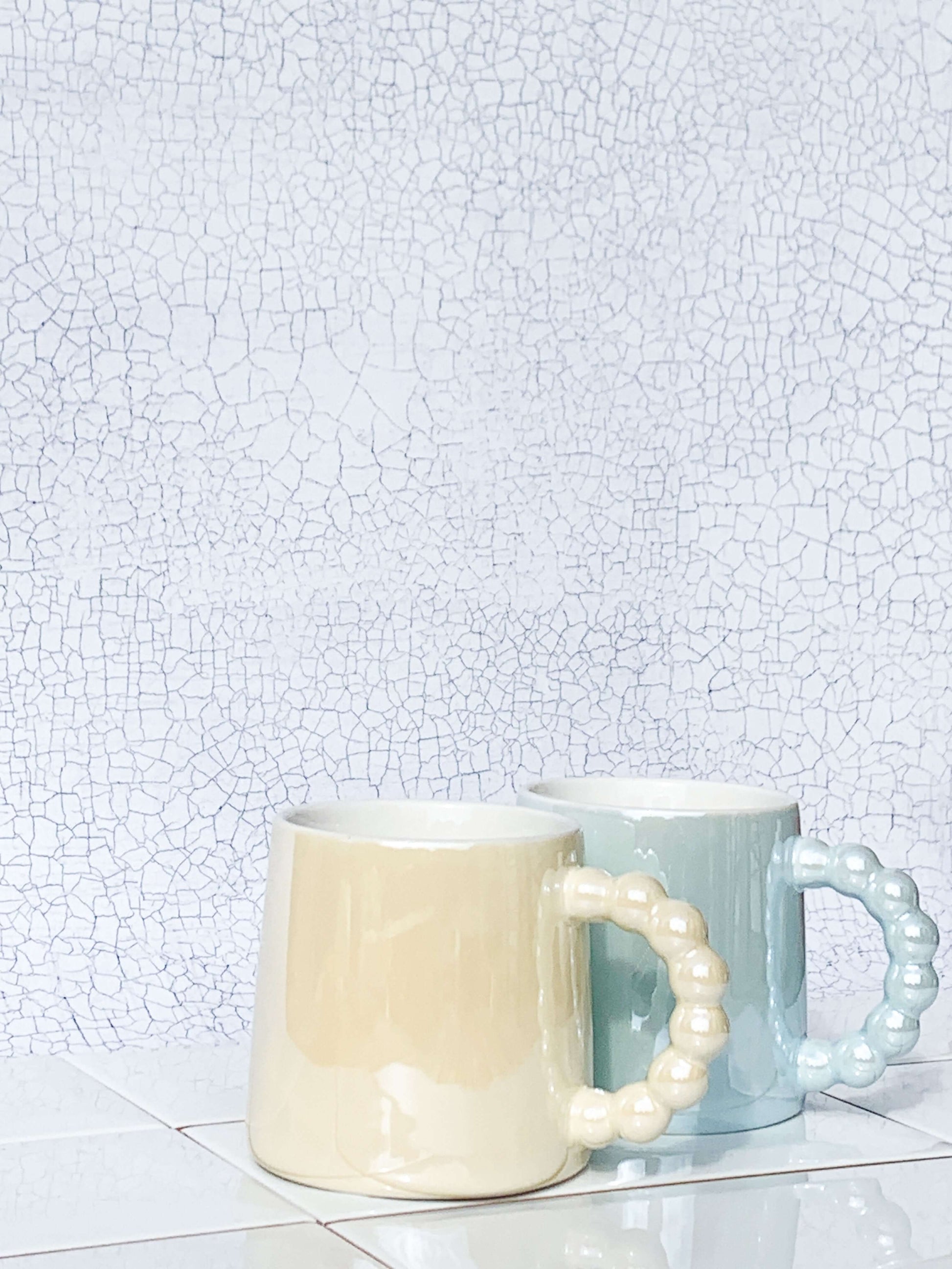 Set of two ceramic coffee or tea mugs. White and blue costal seaside mugs. 