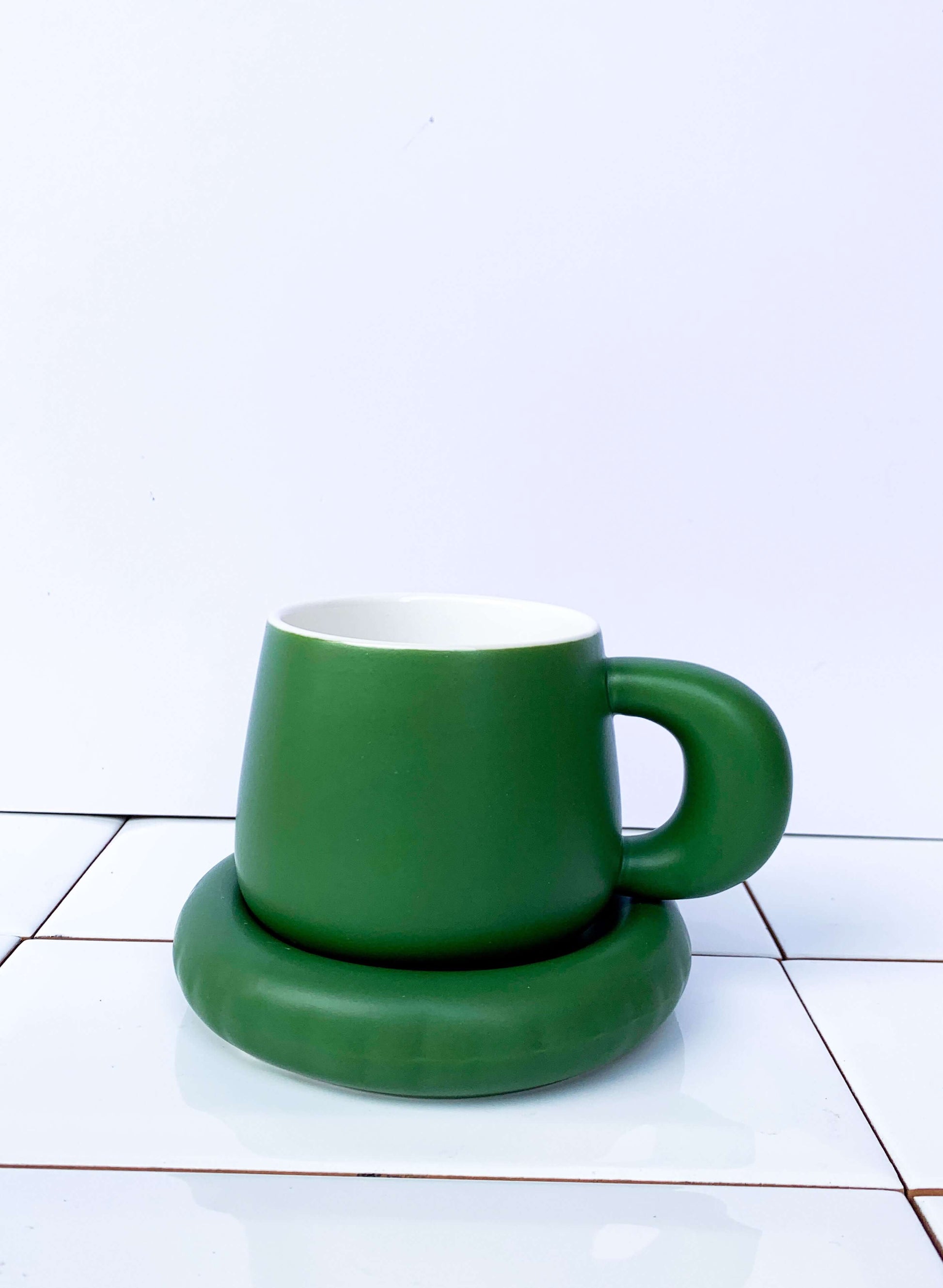 pine green ceramic coffee cup and saucer