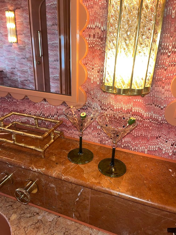 Image of two luxury martini glasses in a luxury setting 