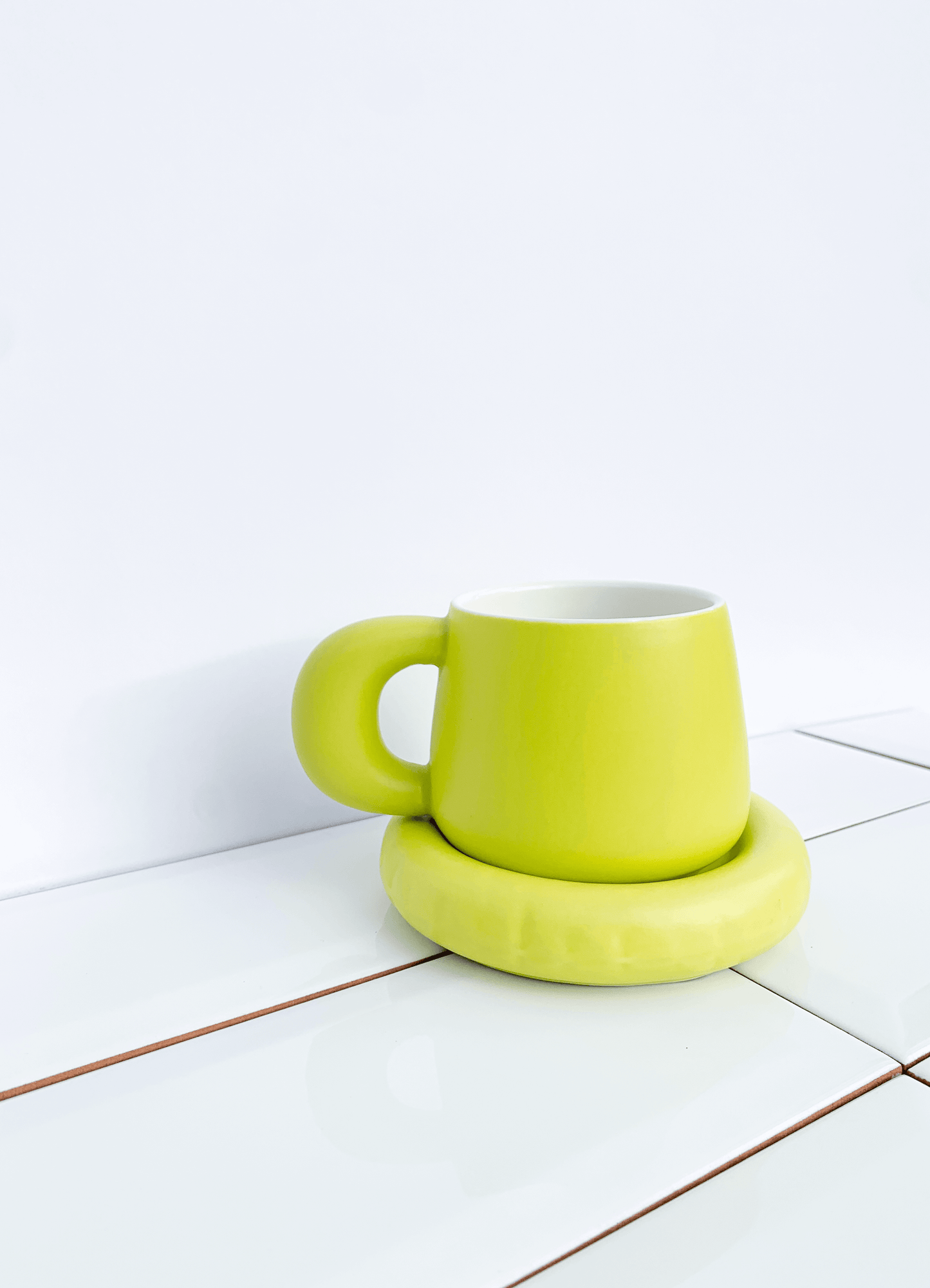 Lime green coffee or team mug and saucer. 